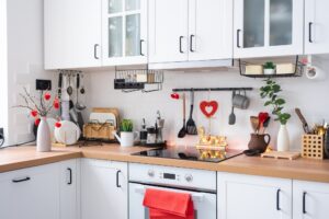 The interior of the kitchen in the house is decorated with red hearts for Valentine's Day