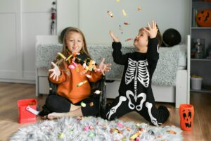 Kids throwing candy for halloween